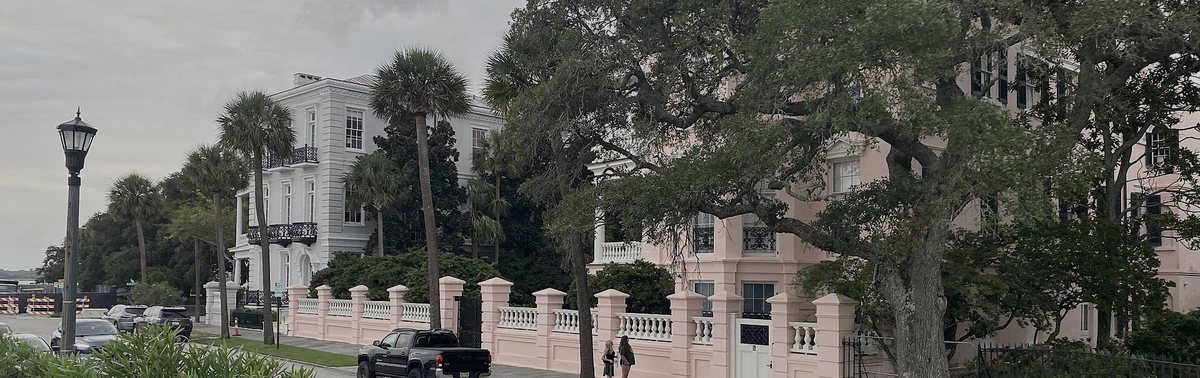 Charleston Battery street homes under a darkened coastal sky