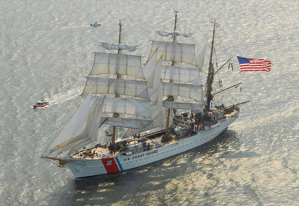 The U.S. Coast Guard Barque Eagle under full sail departing Charleston harbor, South Carolina