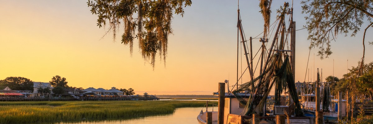 Shem Creek shrimp boats and marsh at golden hour in Mount Pleasant SC