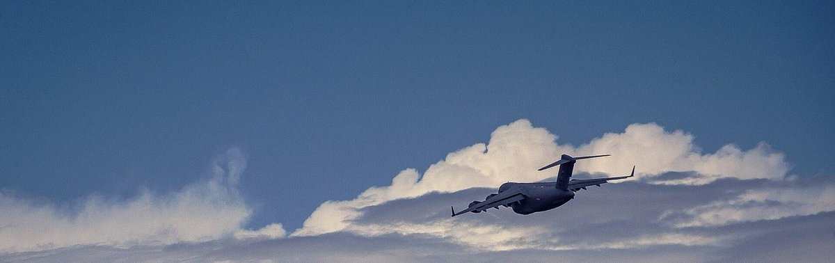 C-17 cargo aircraft over clouds near Joint Base Charleston