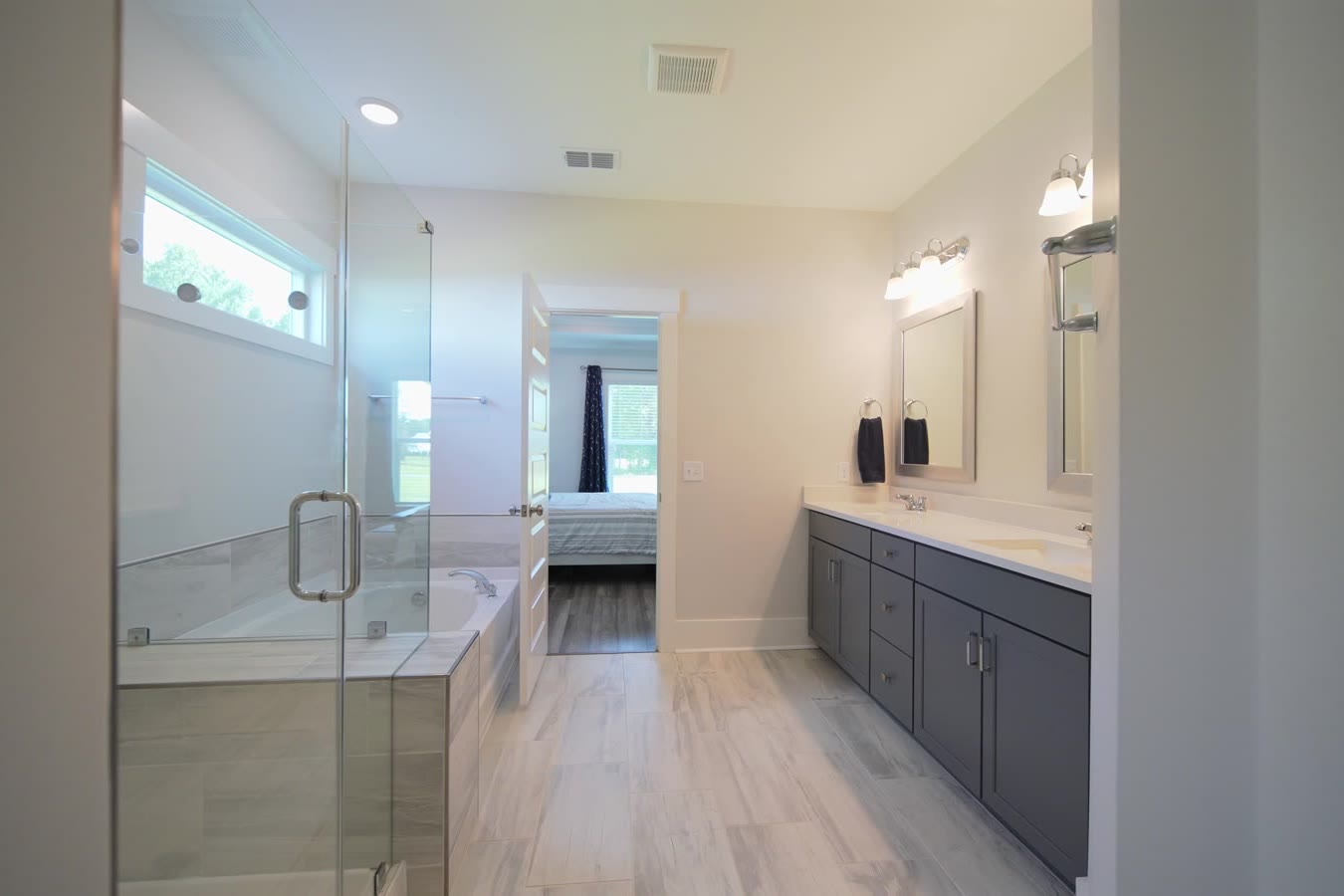 Primary bath with a glass shower and double vanity
